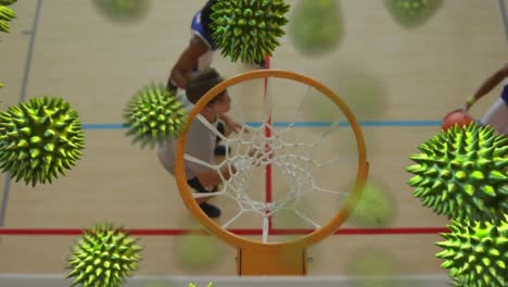 Multiple-covid-19-cells-against-overhead-view-of-group-of-boys-playing-basketball