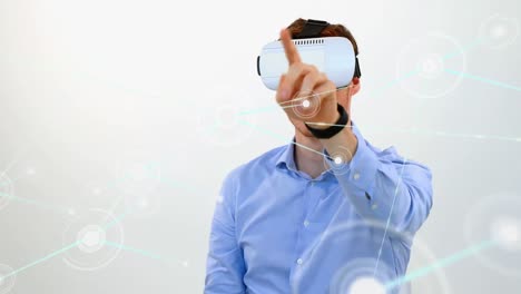 Animation-of-network-of-connections-with-icons-over-businessman-wearing-vr-headset