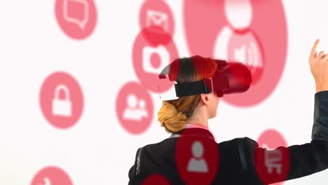 Multiple-digital-icons-over-rear-view-of-businesswoman-wearing-vr-headset-against-white-background