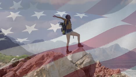 Animation-of-american-flag-moving-over-woman-widening-her-arms-on-beach