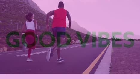 Animation-of-the-words-good-vibes-over-couple-exercising-running-on-mountain-road