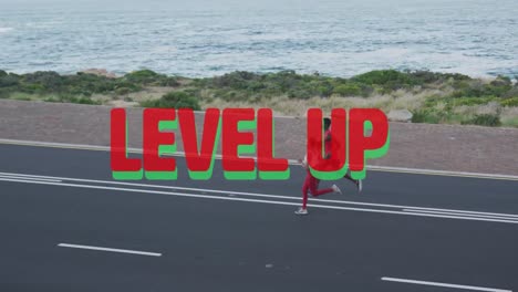 Animation-of-the-words-level-up-in-red-over-couple-exercising-running-on-mountain-road