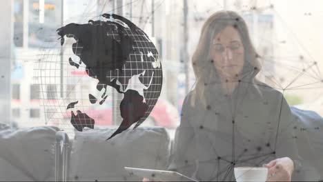 Animation-of-network-of-digital-icons-and-spinning-globe-over-woman-using-smartphone