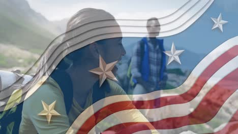 Animation-of-american-flag-over-african-american-couple-smiling-in-mountains