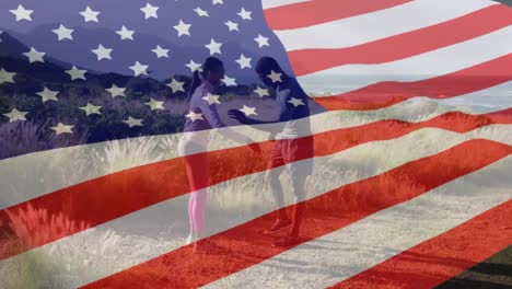 Animation-of-american-flag-over-african-american-couple-exercising-by-sea