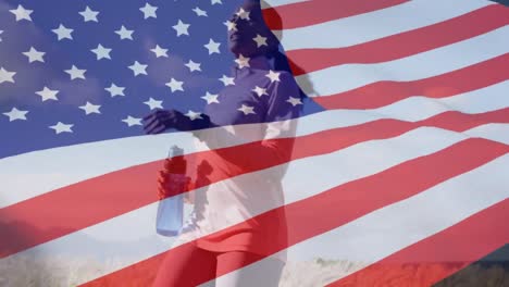 Animation-of-american-flag-over-african-american-woman-running-in-mountains