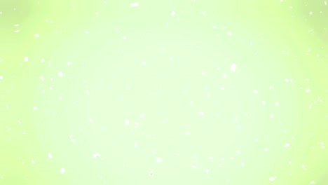 Animation-of-multiple-white-specks-moving-on-green-background