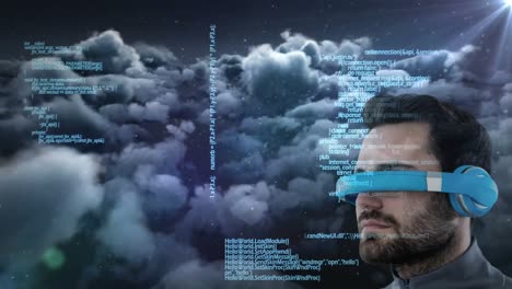 Caucasian-man-wearing-vr-goggles-over-data-processing-against-spot-of-light-and-dark-clouds