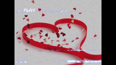 Animation-of-play-interface-heart-shape-of-red-ribbon-with-red-hearts-falling-on-white-background