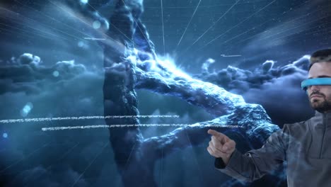 Animation-of-dna-strand-spinning,-man-wearing-vr-headset-against-sky-with-clouds