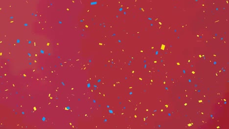 Animation-of-yellow-and-blue-confetti-falling-on-red-background