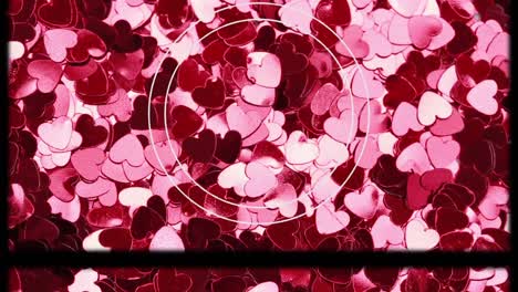 Animation-of-white-circle-and-slipping-film-frame-over-red-and-pink-hearts