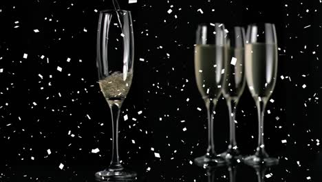Animation-Von-Champagnergläsern-Und-Konfetti,-Die-Auf-Schwarzen-Hintergrund-Fallen
