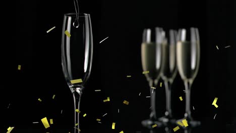 Animation-Von-Champagnergläsern-Und-Konfetti,-Die-Auf-Schwarzen-Hintergrund-Fallen