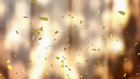 Animation-of-gold-confetti-falling-on-glowing-background