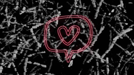 Animation-of-pink-neon-heart-in-speech-bubble,-on-monochrome-grass