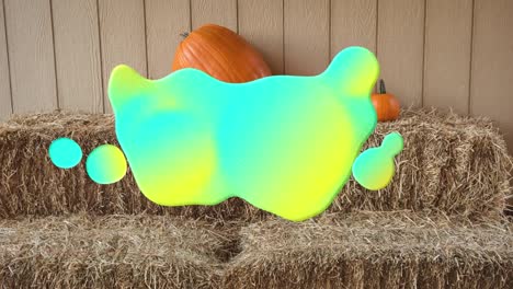 Animation-of-glowing-blobs-over-pumpkins-on-straw