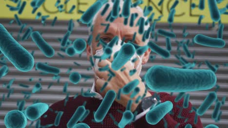Animation-of-bacteria-cells-floating-over-man-wearing-face-mask-in-street