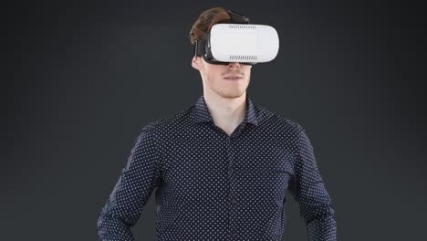 Animation-of-red-specks-over-businessman-wearing-vr-headset