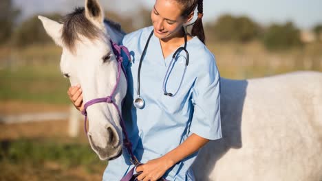 Animation-of-smiling-female-vet-embracing-white-horse-in-countryside