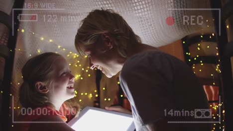 Animation-of-mother-and-daughter-reading-with-camera-recording-screen