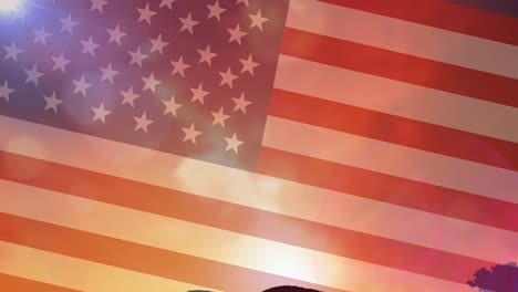 Animation-of-american-flag-over-stunning-sunset