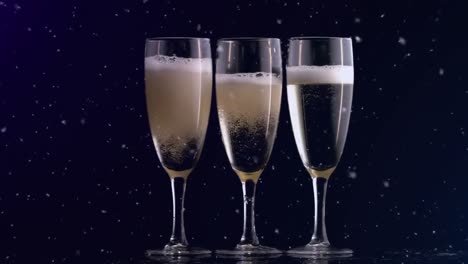 Animation-of-confetti-falling-and-three-glasses-of-champagne-on-black-background