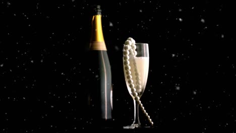 Animation-of-confetti-falling-and-champagne-bottle,-and-glass-with-pearl-necklace-in-it,-on-black