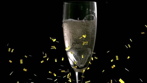 Animation-of-gold-confetti-falling-and-glass-of-champagne-on-black-background