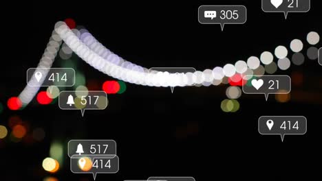 Animation-of-social-media-icons-and-data-processing-over-out-of-focus-lights-of-cityscape
