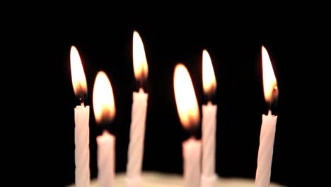 Animation-of-dots-flying-over-birthday-candles