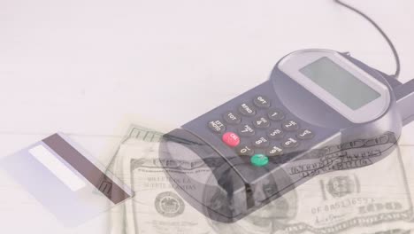 Animation-of-dollar-banknotes-falling-over-payment-terminal