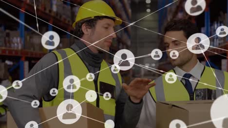 Animation-of-network-of-connections-with-icons-over-men-working-in-warehouse