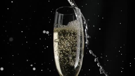 Animation-of-white-specks-floating-over-glass-of-champagne-on-black-background