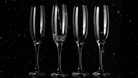 Animation-of-white-specks-floating-over-glasses-of-champagne-on-black-background