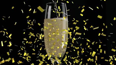 Animation-of-gold-confetti-falling-over-glass-of-champagne-on-black-background