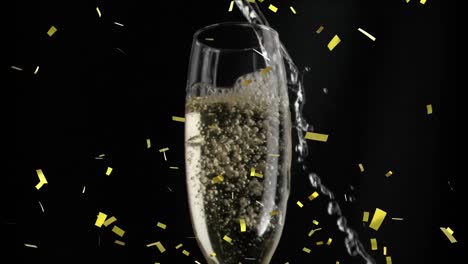 Animation-of-gold-confetti-falling-over-glass-of-champagne-on-black-background