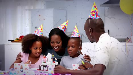 Animation-Von-Netzwerken-über-Die-Familie,-Die-Spaß-Auf-Der-Geburtstagsfeier-Hat