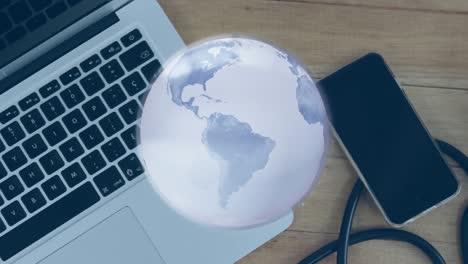 Animation-of-globe-with-network-of-connections-over-laptop