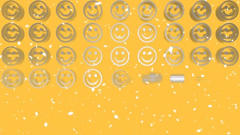 Animation-Von-Weißem-Konfetti,-Das-über-Reihen-Von-Smiley-Emojis-Aus-Metall-Auf-Gelbem-Hintergrund-Fällt