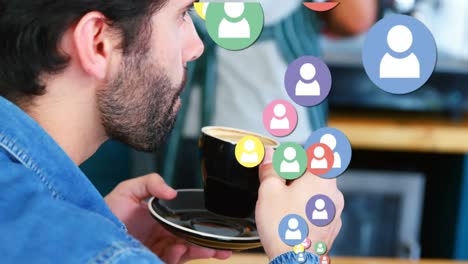 Animation-of-social-media-icons-and-numbers-over-man-drinking-coffee