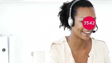 Animation-of-numbers-changing-over-businesswoman-using-phone-headset