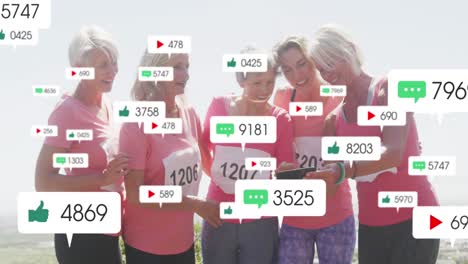 Animation-of-social-media-notifications,-over-female-runners-looking-at-tablet-on-beach