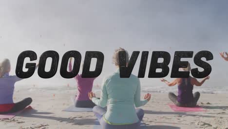 Animation-of-text-good-vibes,-in-black,-with-women-doing-yoga-sitting-on-beach