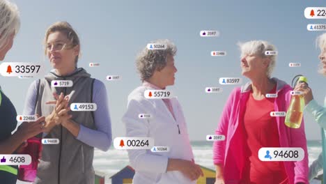 Animation-of-social-media-notifications,-over-women-talking-on-beach