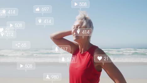 Animation-of-social-media-notifications,-over-senior-woman-smiling-on-beach