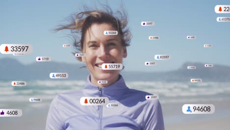 Animation-of-social-media-notifications,-over-woman-smiling-on-beach