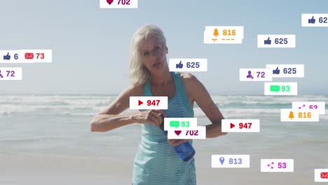Animation-of-social-media-notifications,-over-woman-drinking-water-on-beach