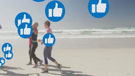 Animation-of-thumbs-up-like-symbols,-over-women-running-on-beach