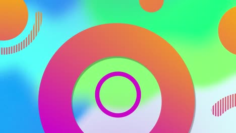 Animation-of-orange-and-pink-circles-and-rings-moving-over-blurred-blue-and-green-shapes